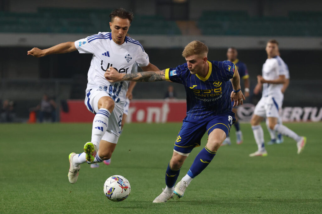 VERONA, ITALY - MAY 18: Maxence Caqueret of Como and Nicolas Valentini of Verona in action during the Serie A match between Verona and Como